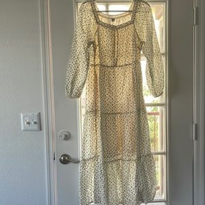 Beautiful prairie-like dress. Black floral print with gold embellishments